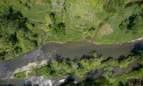 An aerial view of a small creek