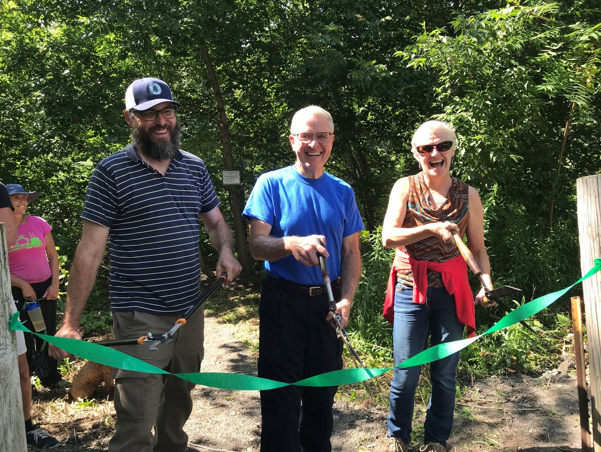 A ribbon cutting ceremony celebrating the new trail