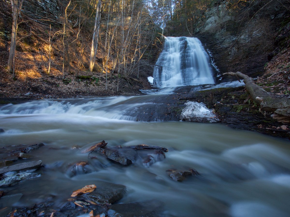 A waterfall and creek in winter