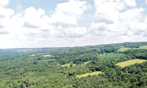 An aerial view of rolling green hills