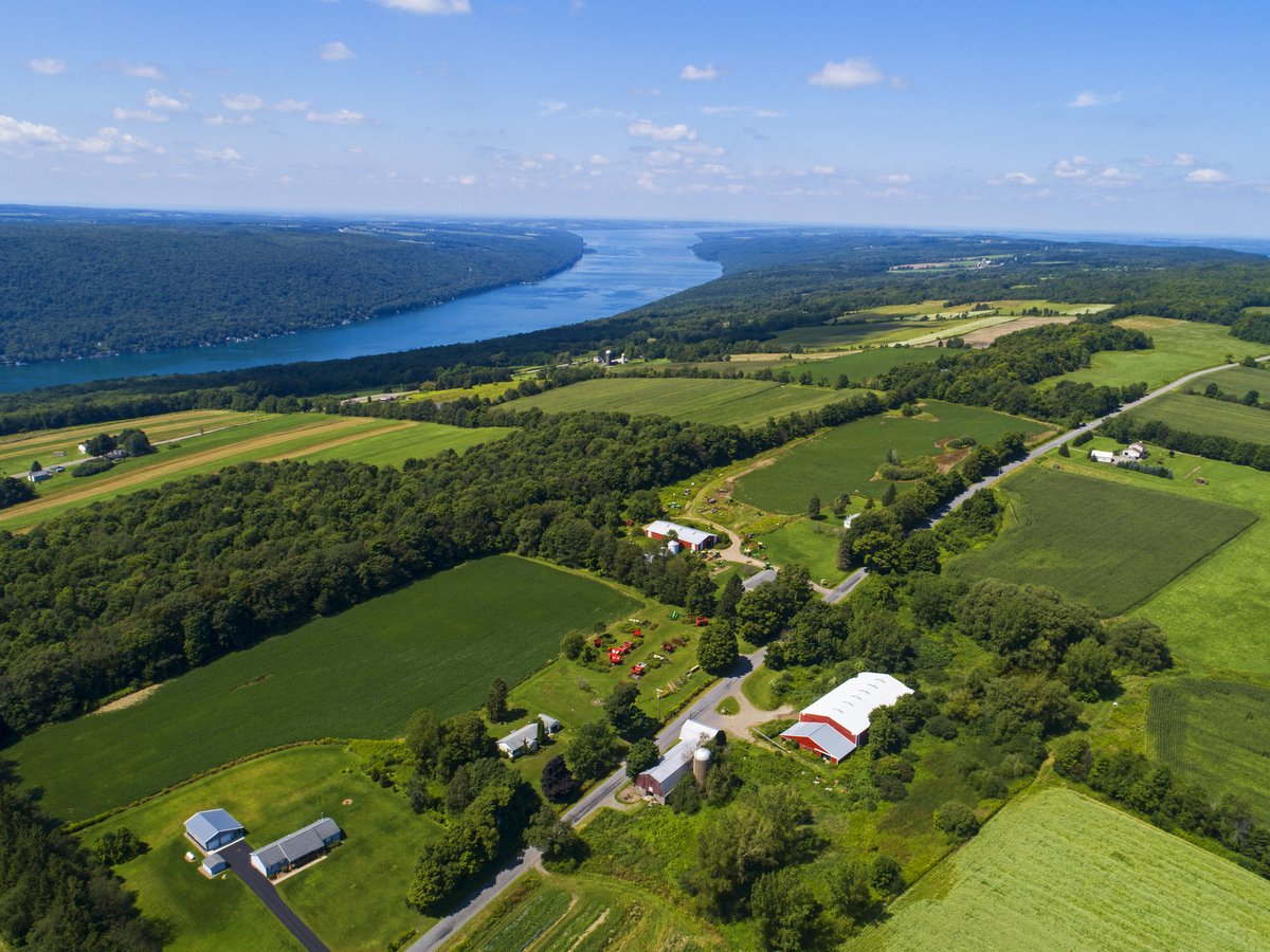 An aerial view of farmland on hills above Skaneateles Lake