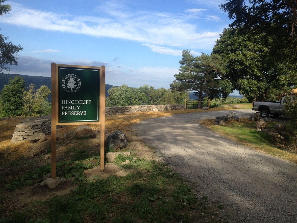 An entrance to a nature preserve parking lot