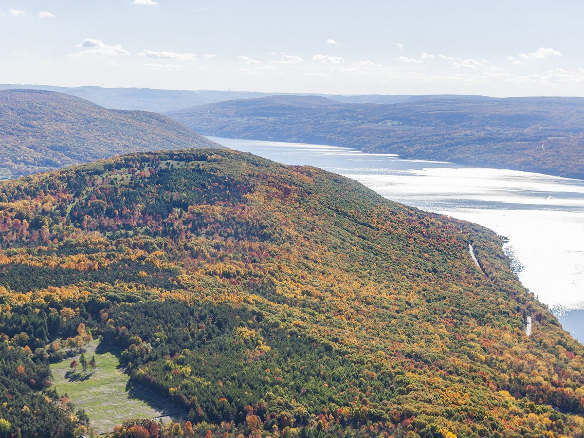 An aerial view of Canandaigua Lake and its surrounding hillsides