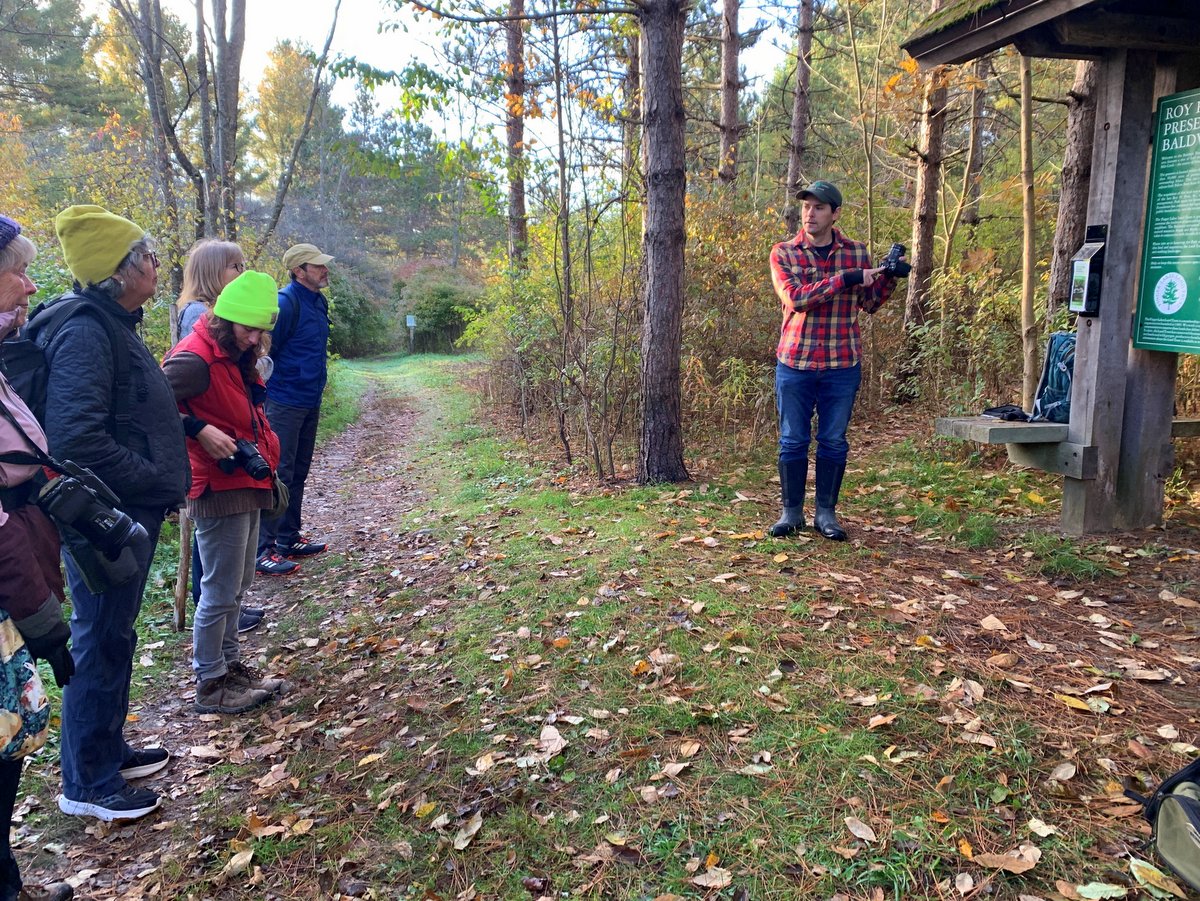 A group of people gathered for a nature hike