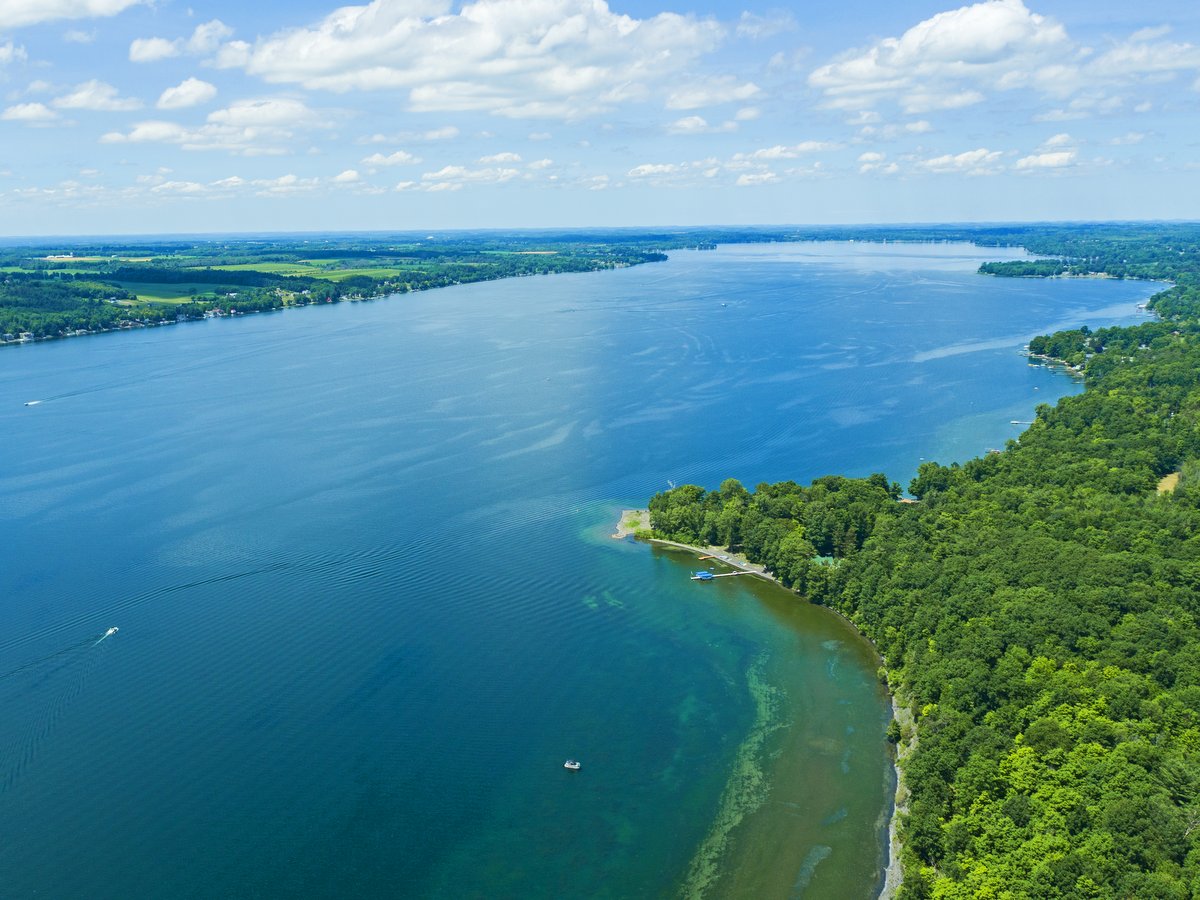 An aerial view of a long blue lake