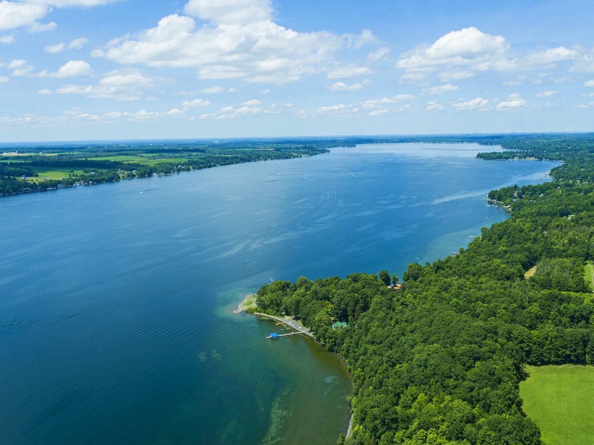 An aerial view of a long blue lake