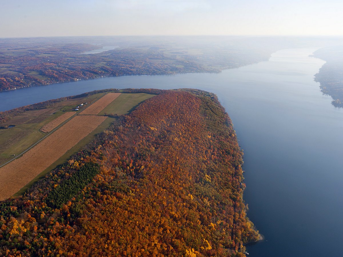An aerial view of a bluff overlooking a lake